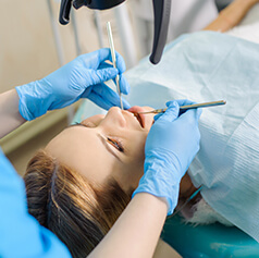 woman receiving a dental exam