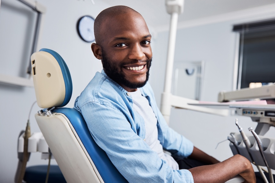 man in dental chair, changing dentists, new dentist, switch dentist